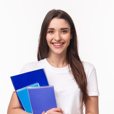 Education, university and studying concept. Close-up portrait of friendly joyful female student with books and paperworks smiling camera, waiting for friend near classes or campus, smiling happy